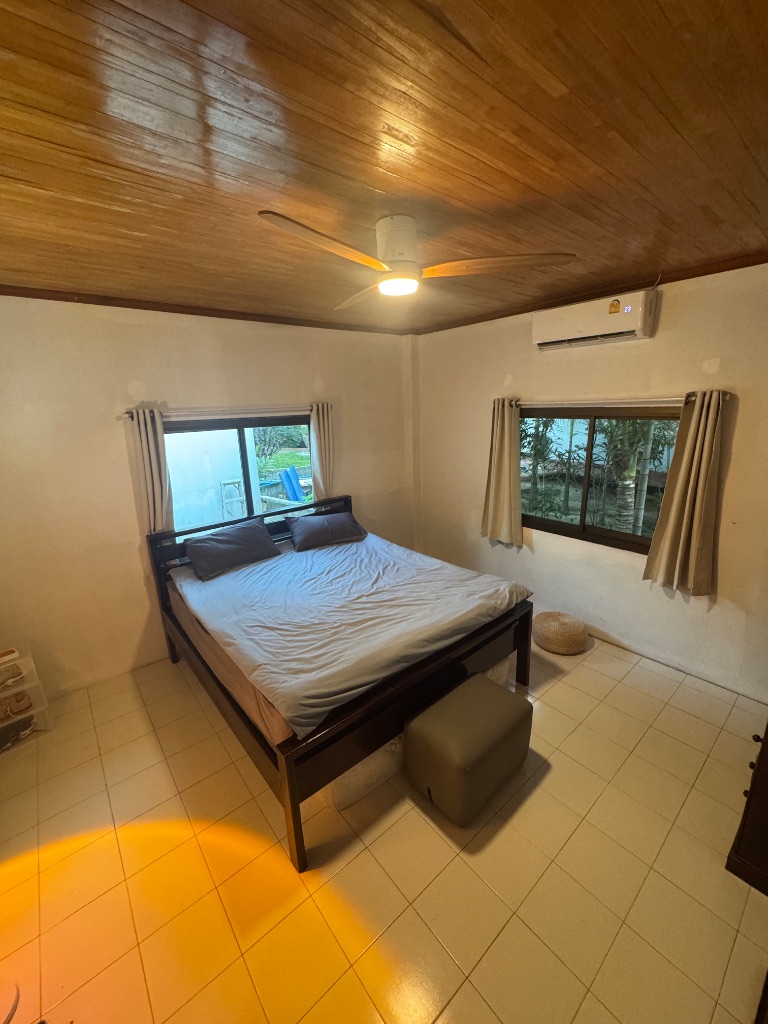 Bedroom with wooden ceiling
