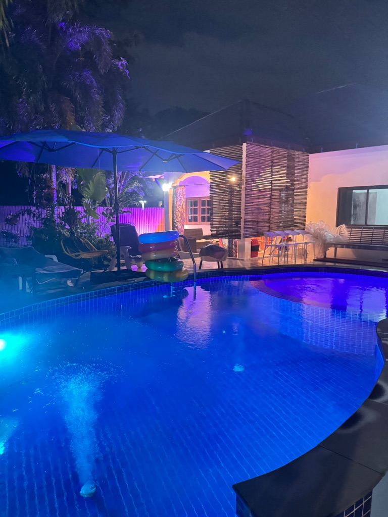 Pool illuminated blue at night