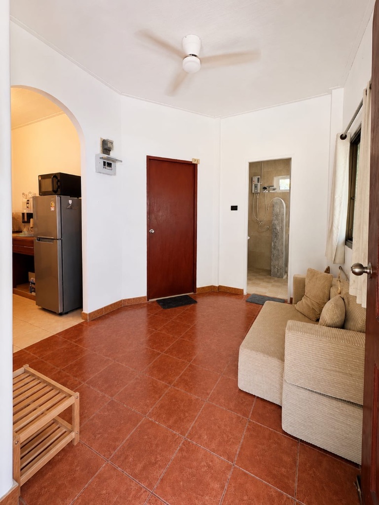 House 2 — living room with fully equipped kitchen