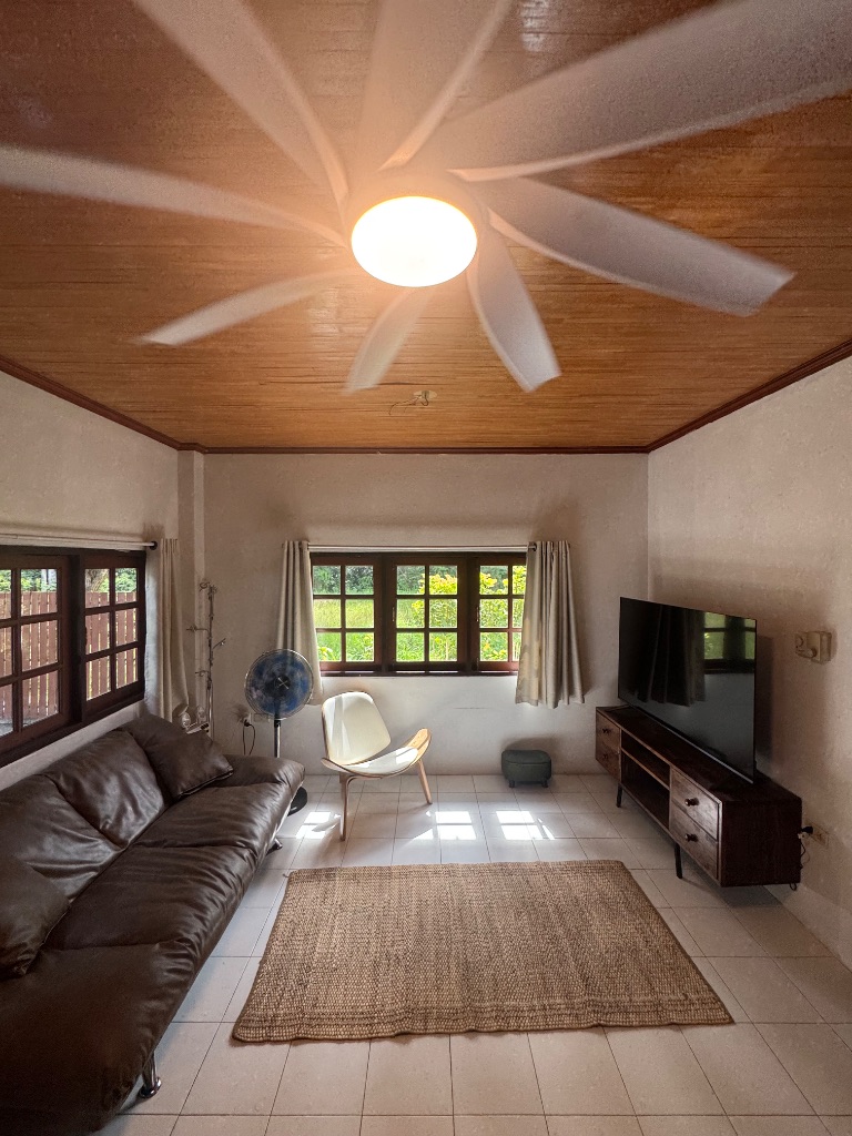 The Villa — huge living room with big sofa and TV